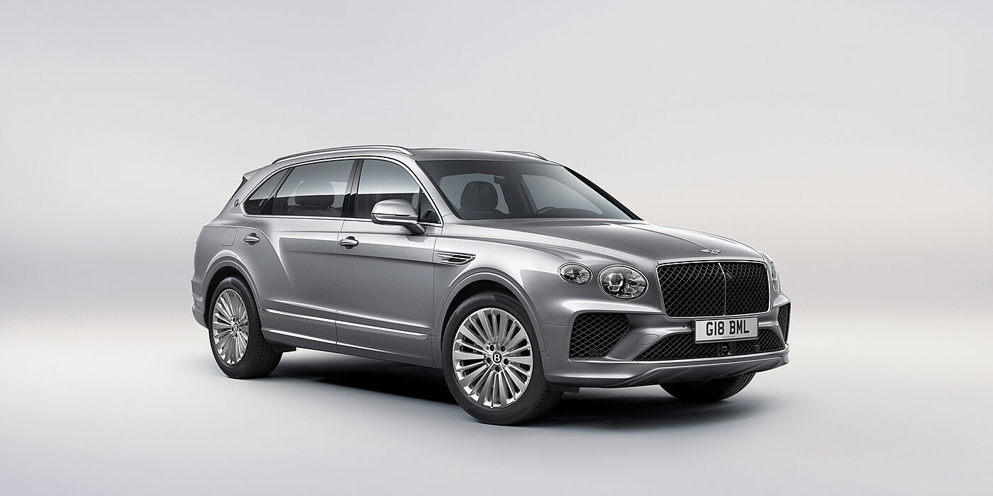 Bentley Belfast Bentley Bentayga Extended Wheelbase luxury SUV front three quarter view in Moonbeam paint with 21 inch five spoke painted wheels