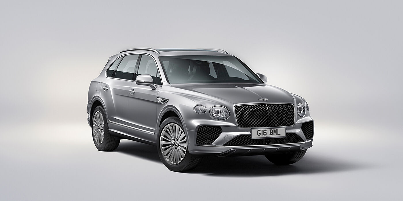 Bentley Belfast Bentley Bentayga luxury SUV front three quarter view in Moonbeam paint with matrix grille and 21″ 5 spoke painted wheels