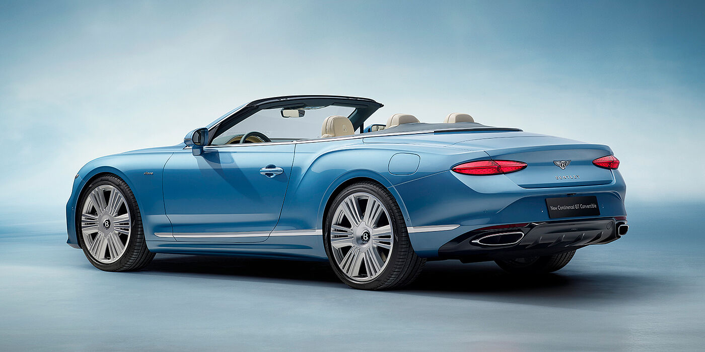 Bentley Belfast New Bentley Continental GTC Azure convertible rear view in Light Windsor blue paint with 22 inch ten spoke wheels and chrome exterior details