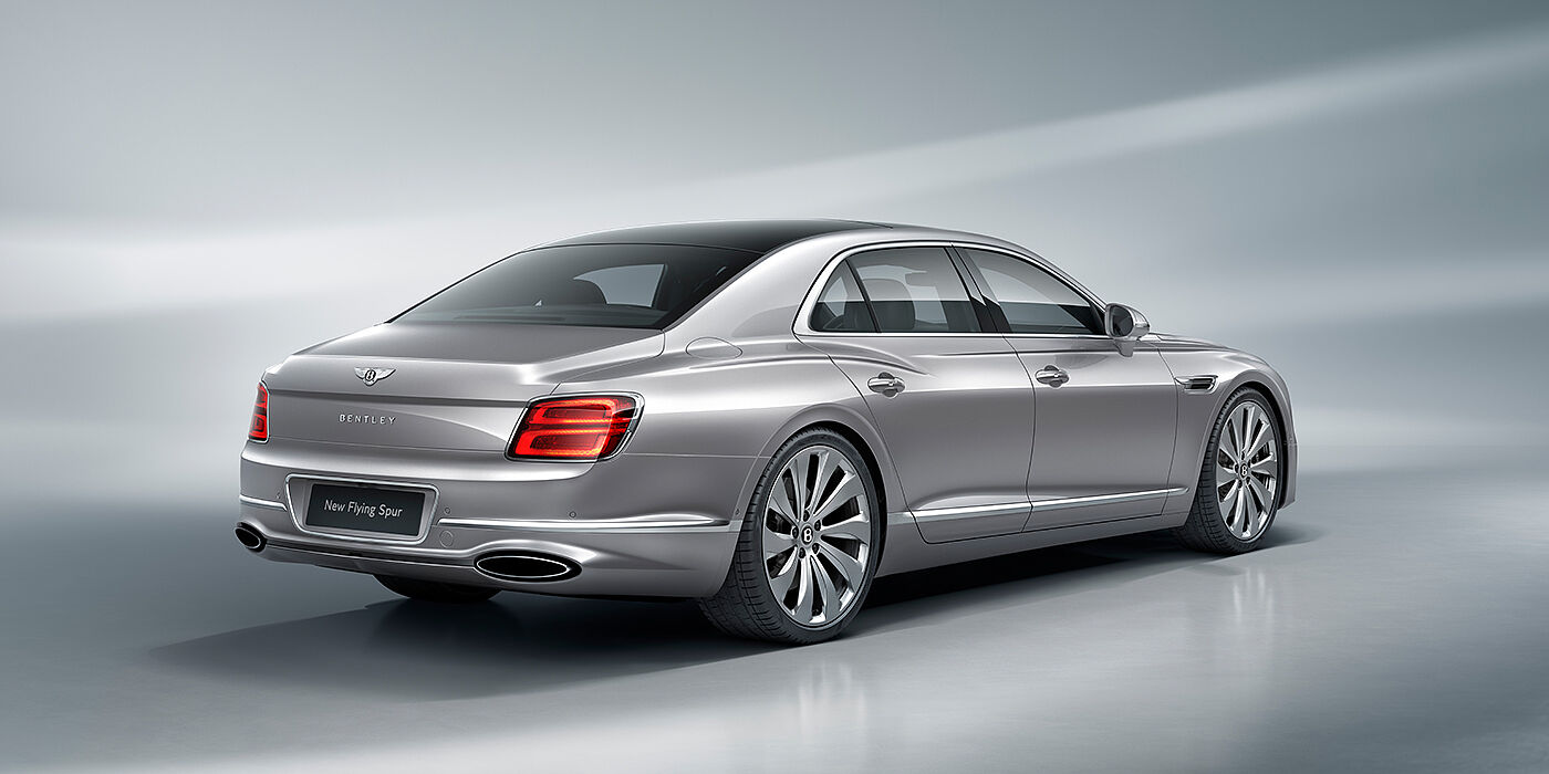 Bentley Belfast New Bentley Flying Spur sedan rear view in Silverlake paint with ten spoke wheels and chrome matrix grille